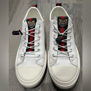 White low tops with Gucci stripe